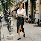 Black high-waisted wrap midi skirt on model, knotted waist with high front slit