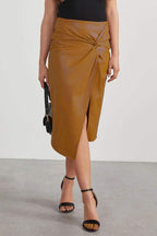 Apricot faux leather midi skirt with high-waist knot detail and asymmetrical front slit