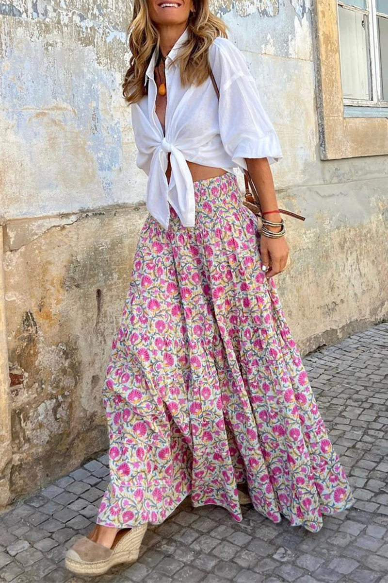 Women's high-waist maxi skirt with pink and green floral print, gathered tiered fabric