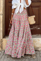 Women's high-waist maxi skirt with small floral print, gathered full-length tiers