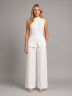 White sleeveless co-ord set: high-neck button top & wide-leg trousers