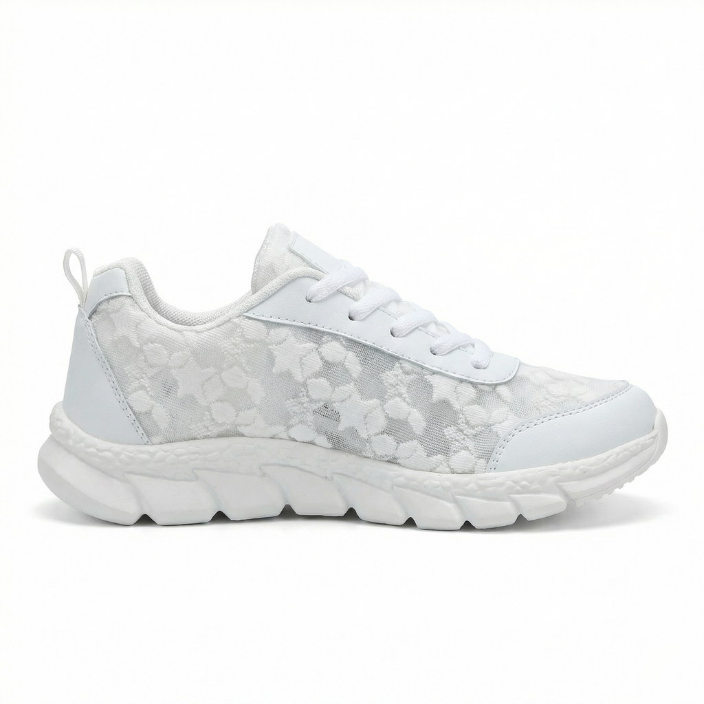 Single women’s white lace-up sneaker with patterned upper and thick cushioned tread sole