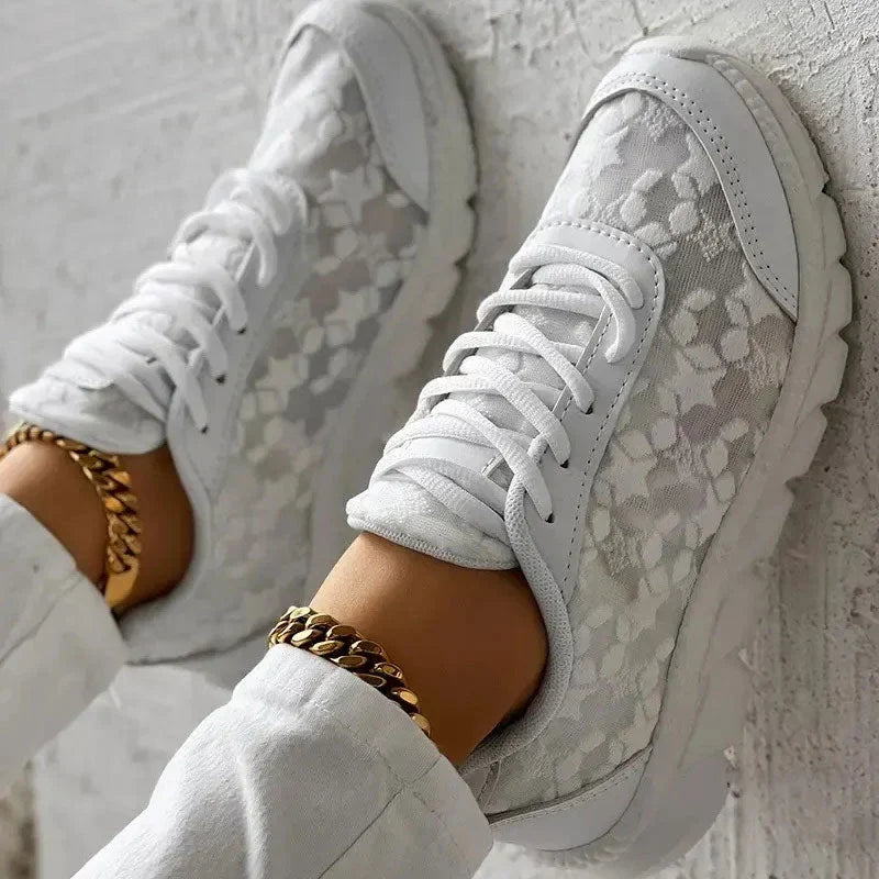 Women’s white lace-up sneakers with patterned fabric and side panel stitching detail
