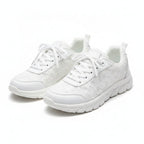 White mesh sneakers with lace-up front and cushioned sole