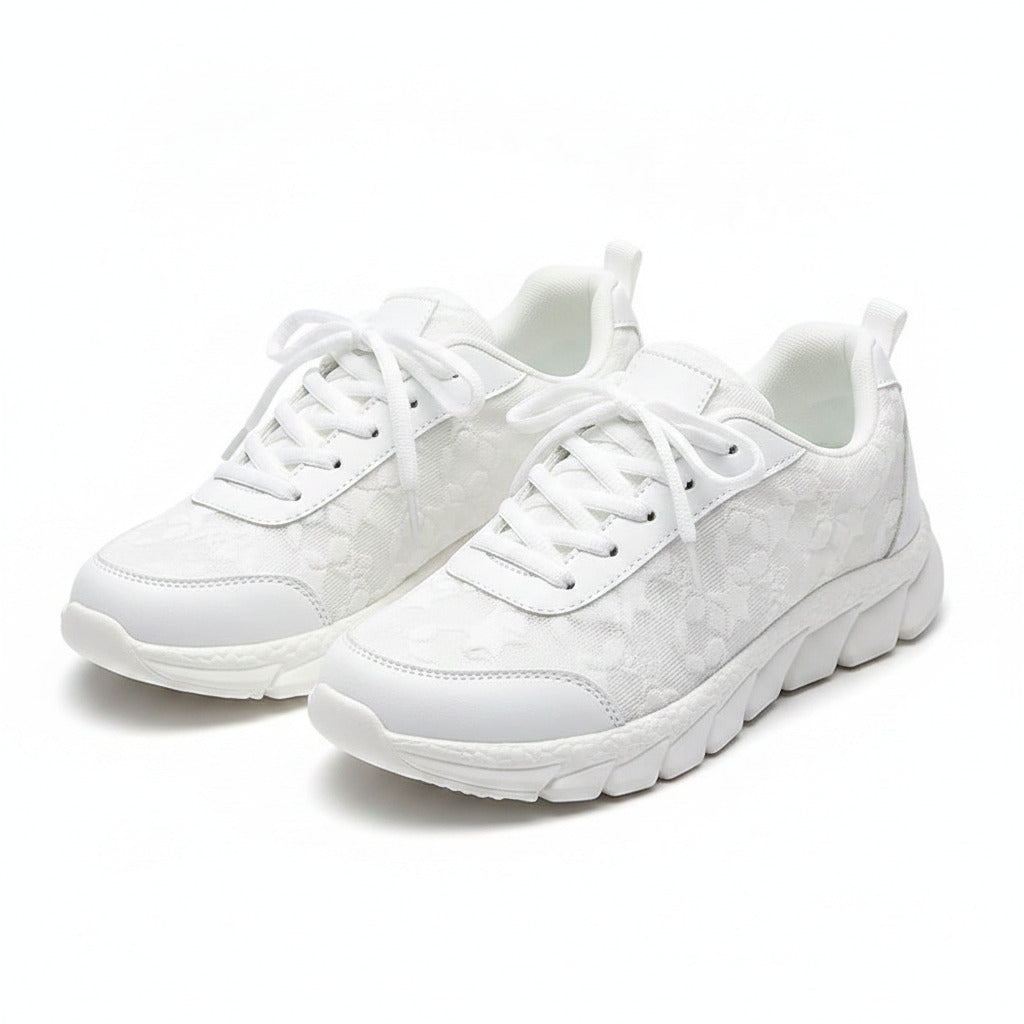 White mesh sneakers with lace-up front and cushioned sole
