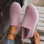 Women's pink slip-on sneakers with breathable knit upper and white air-cushion sole