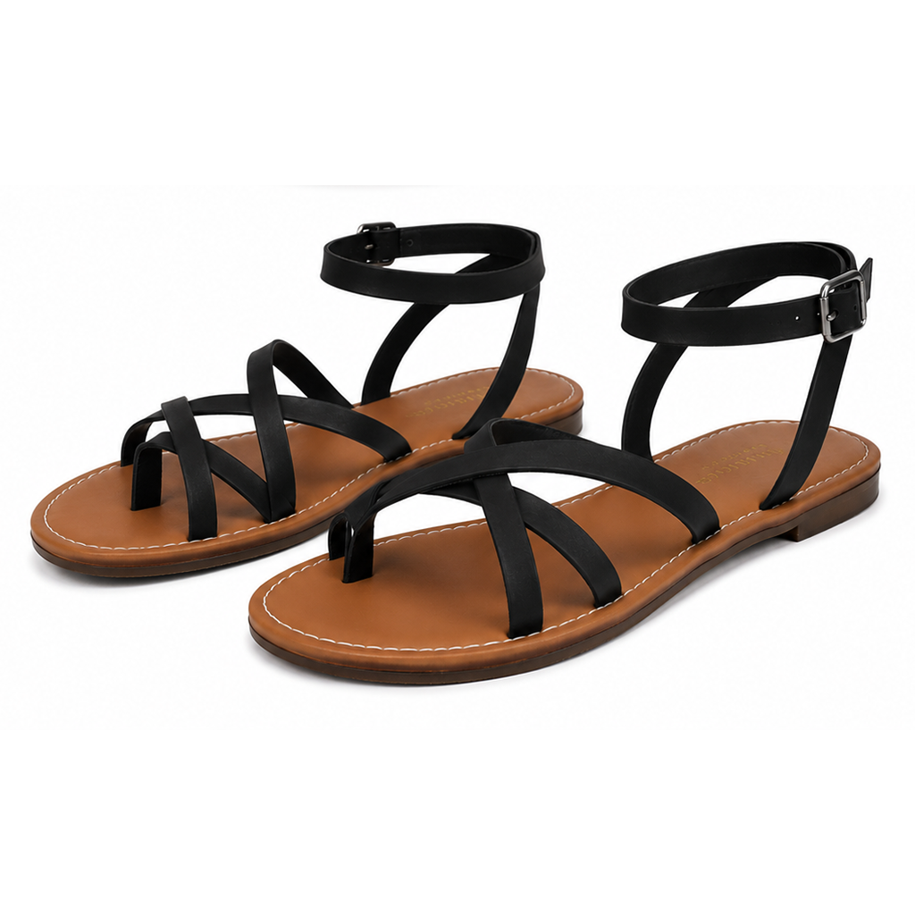 Women's black flat open-toe sandals with criss-cross straps and ankle buckle, tan sole