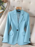 Light blue tailored blazer with notch lapels, flap pockets, and button front