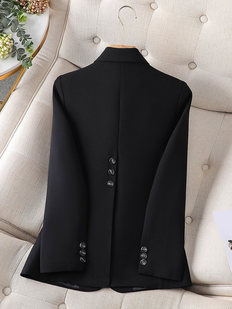 Black blazer back view with center seam and structured shoulders
