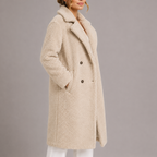 Beige long teddy coat with double-breasted front, notched collar, and side seam pockets