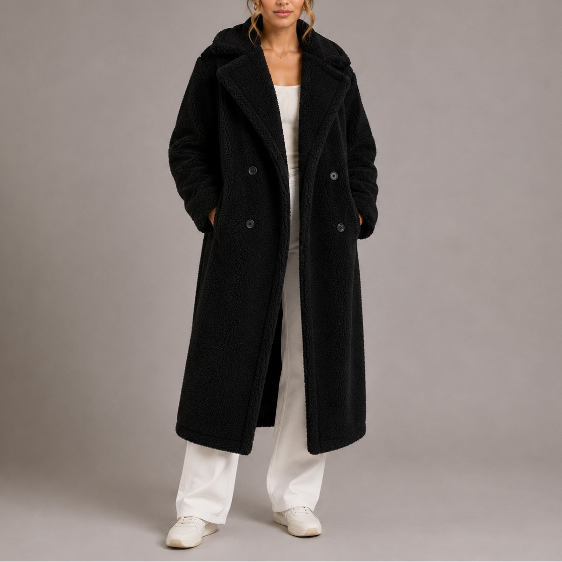 Black long double-breasted teddy coat with notched lapels and dark button closure