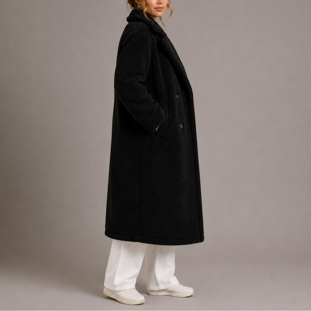 Black teddy coat with double-breasted buttons and notched hood collar; long length