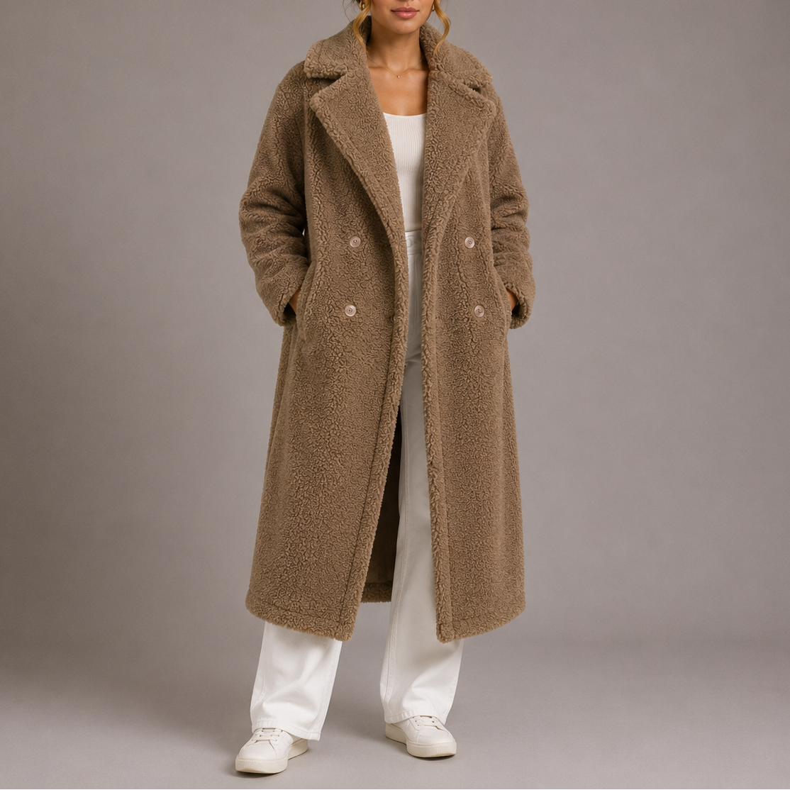 Brown long teddy coat with double-breasted front, notched lapels, and button details