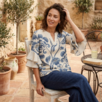 Women's floral print V-neck blouse with tiered short sleeves, blue on white