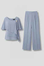 Women’s blue layered top and straight-leg trousers set, top and pants flat lay