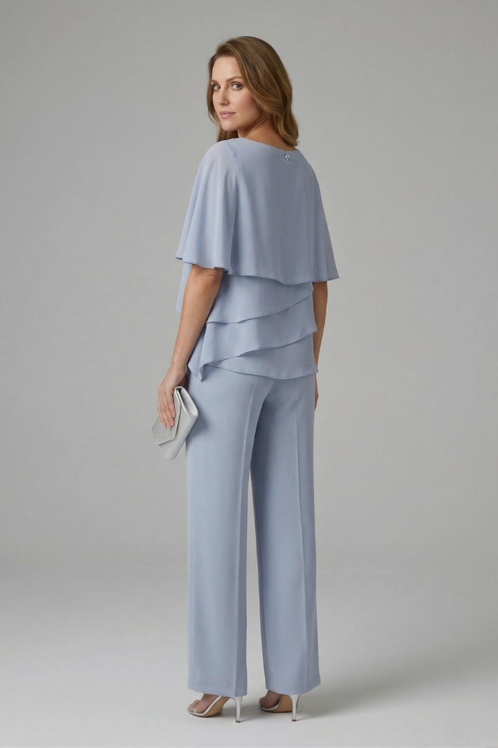 Women’s blue layered top and straight-leg trousers set, side view with layered top