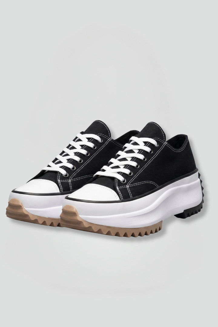 Women’s black trainers with white laces, chunky leather platform sole
