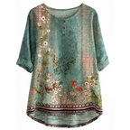 Teal floral print short-sleeve blouse with round neck and button placket, relaxed hem.