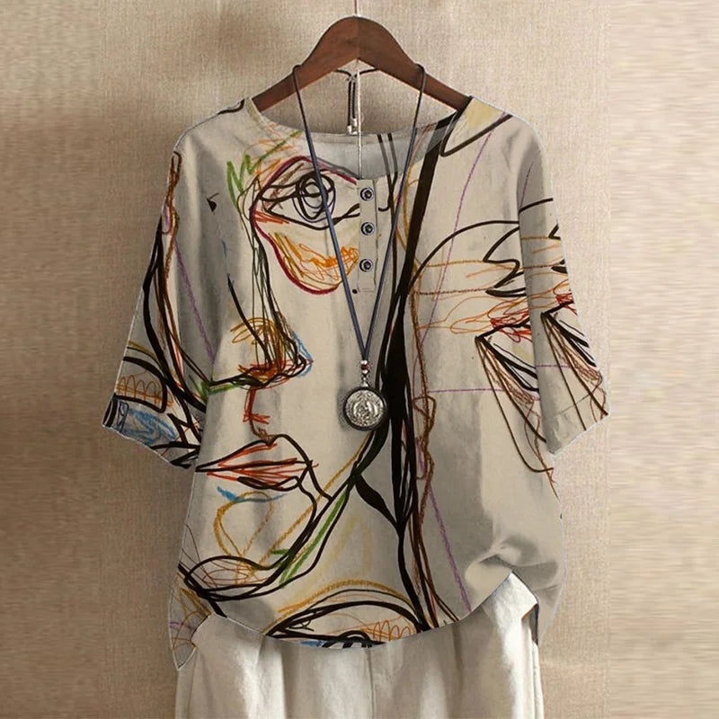 Women’s floral print short-sleeve blouse, round neck, button front; light abstract design.