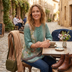 Women’s teal floral blouse, round neck, three-quarter sleeves with button placket.