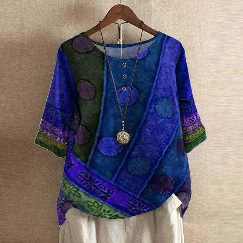 Women’s blue blouse with multicolor circular prints, short sleeves, round neck