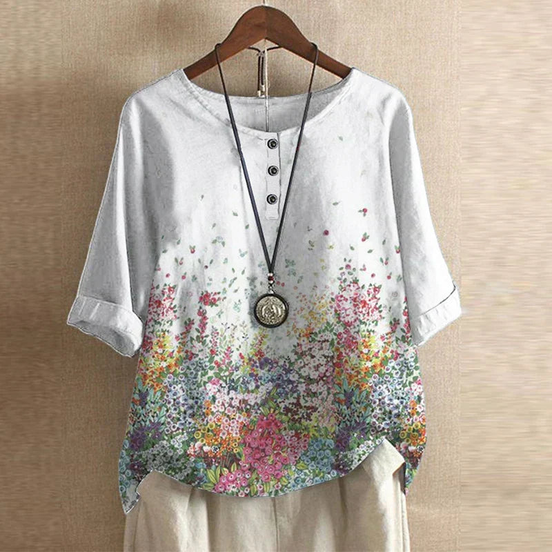 Women’s white floral print blouse with colorful flowers, short sleeves, round neck