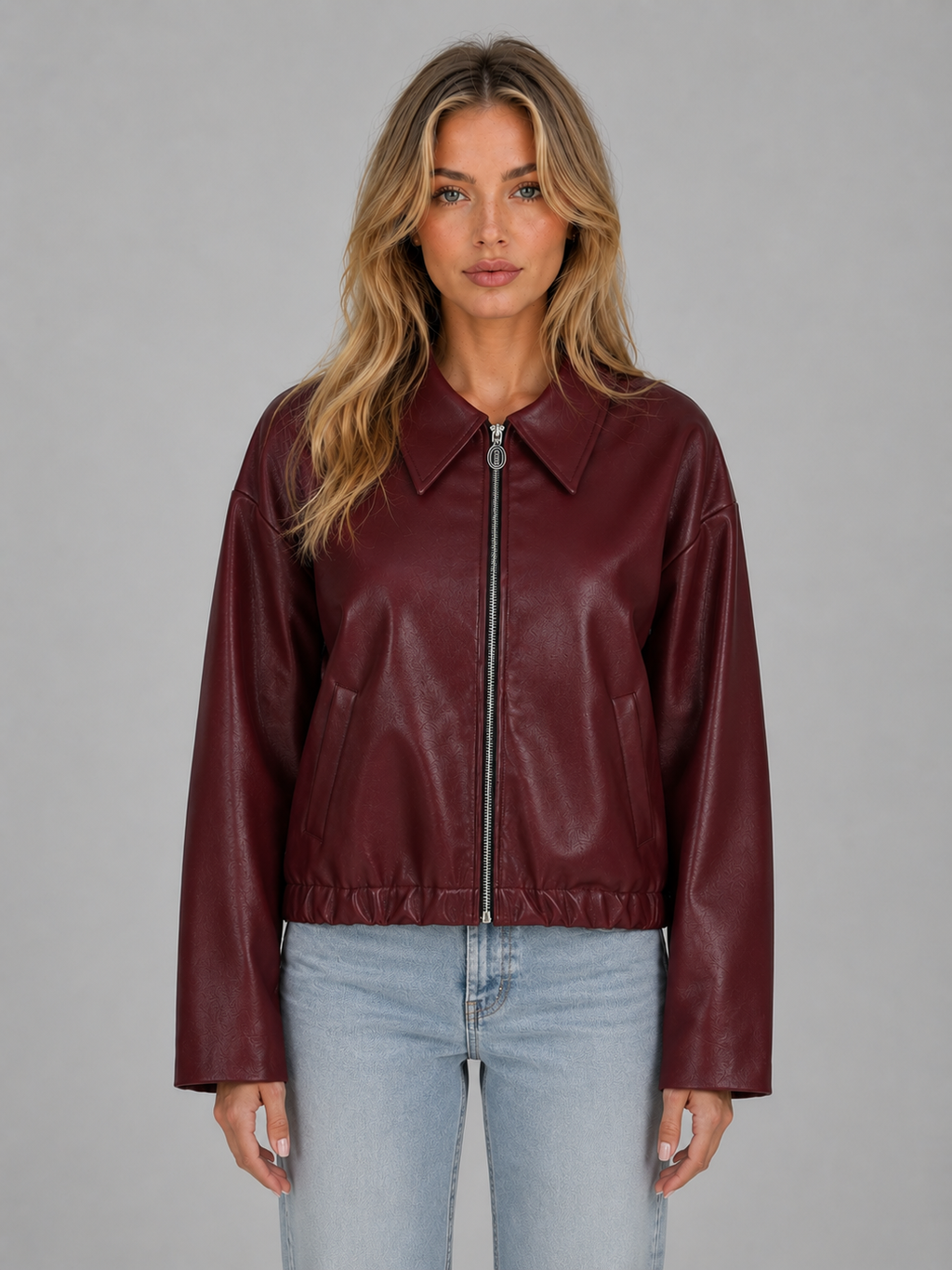 Burgundy leather zip-up jacket with pointed collar, relaxed cropped fit, side pockets