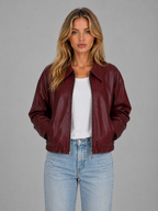Burgundy leather bomber-style zip jacket with pointed collar and relaxed cropped hem