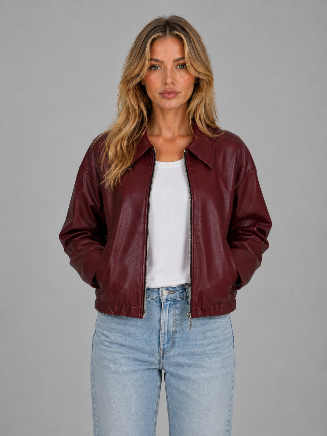 Burgundy leather bomber-style zip jacket with pointed collar and relaxed cropped hem