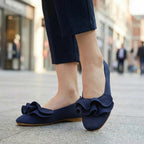 Navy wide-fit slip-on knit shoes with arch support, bow detail, flat sole
