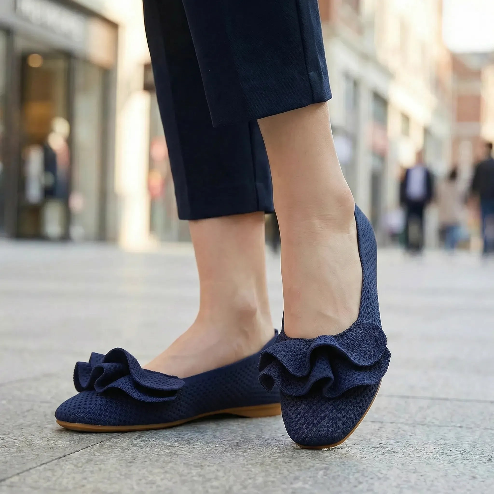 Navy wide-fit slip-on knit shoes with arch support, bow detail, flat sole