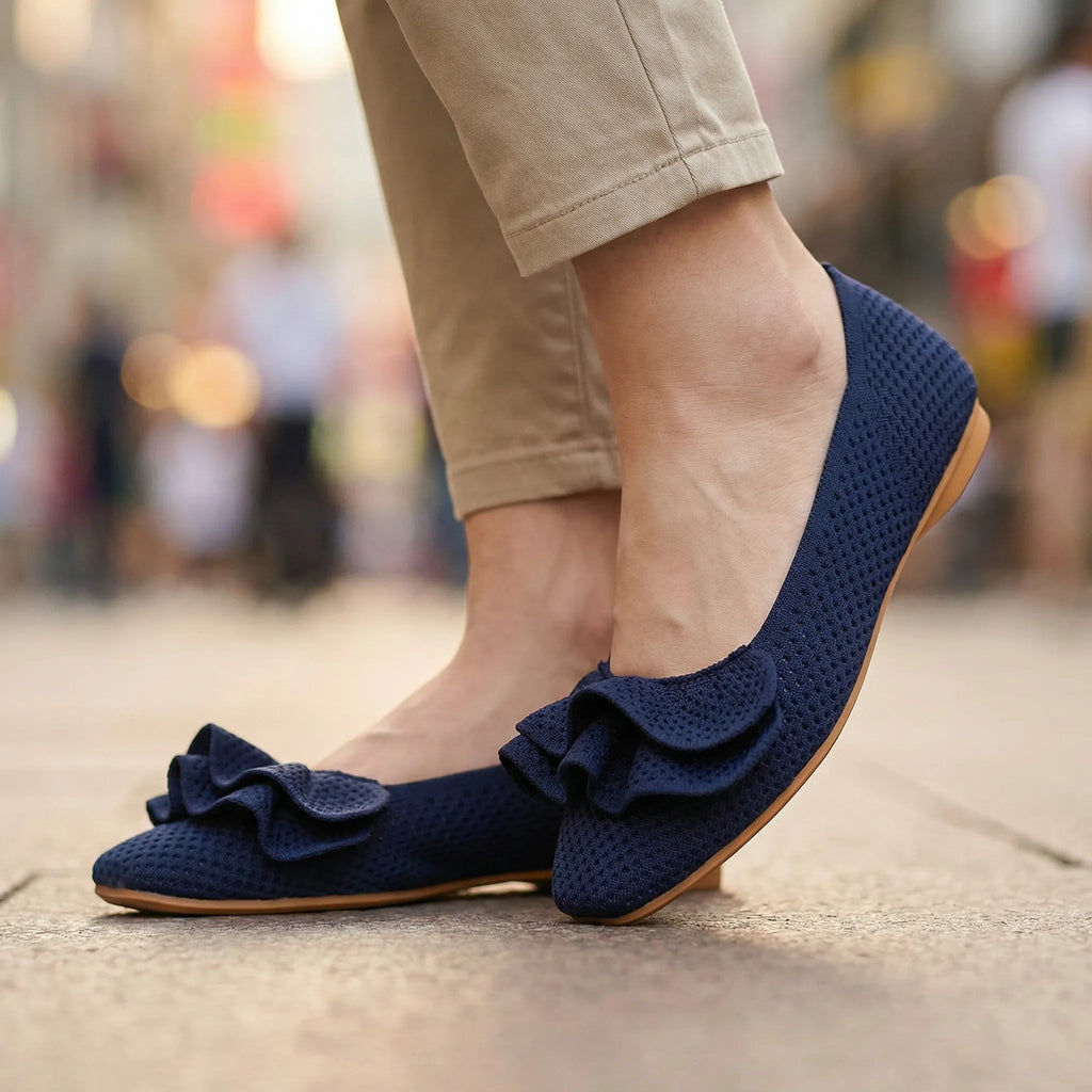 Navy wide-fit slip-on knit shoes with arch support, cushioned insole and bow detail