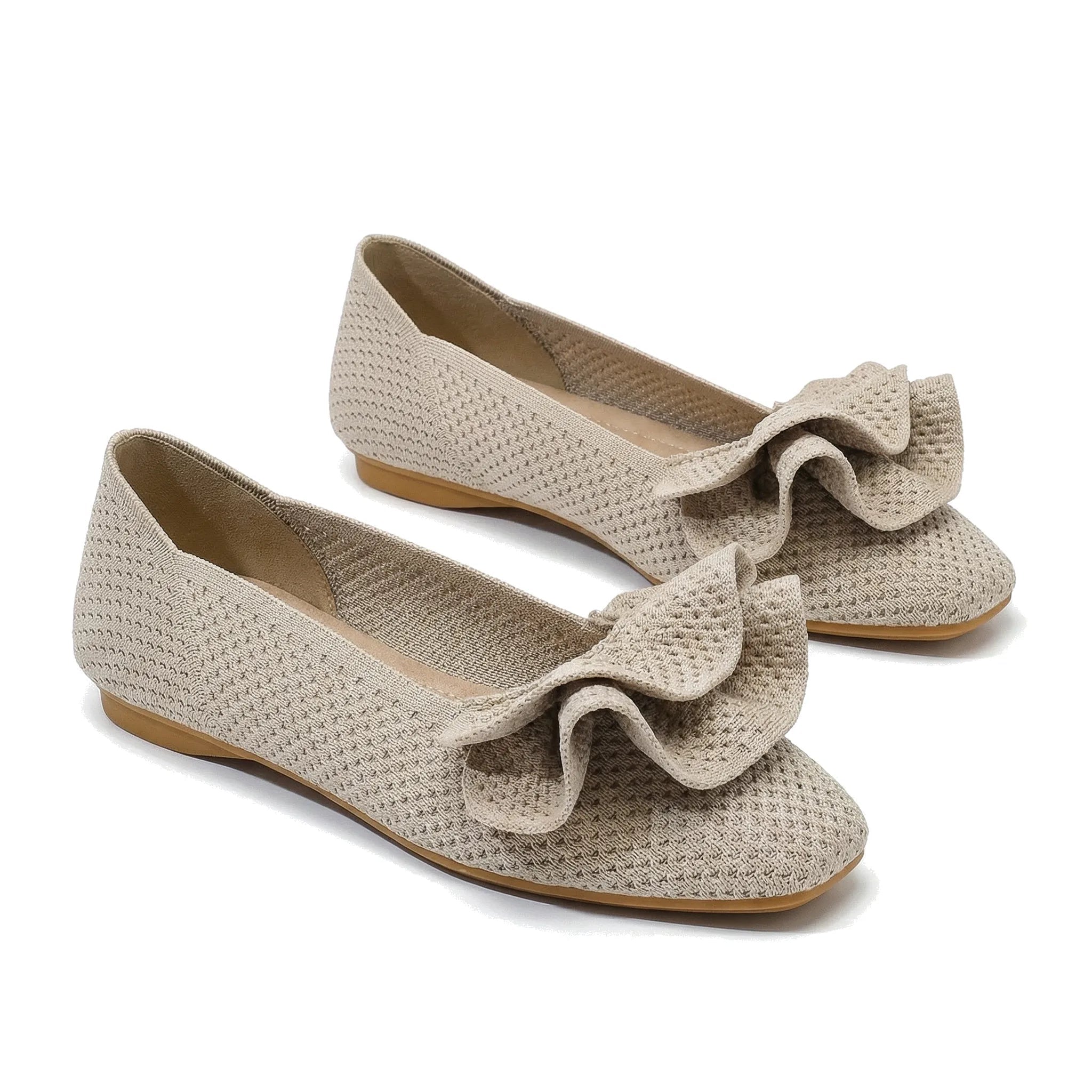 Light beige wide-fit slip-on knit shoes with arch support, bow detail, flat sole