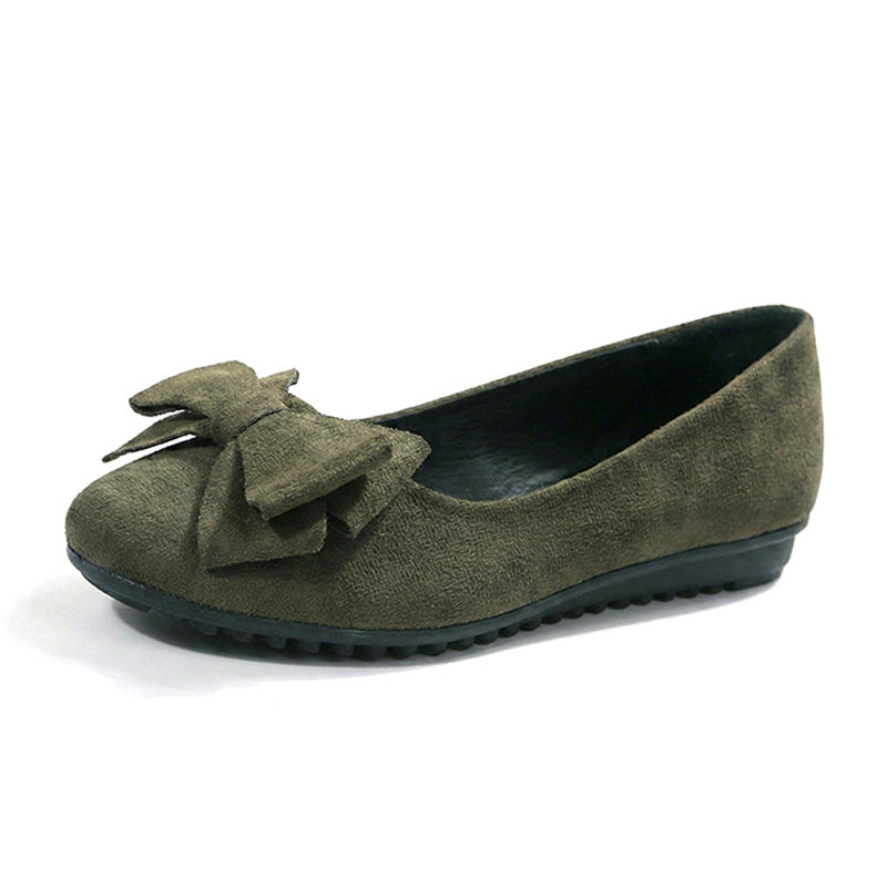 Wide fit cushioned ballet flats in dark green faux suede, side view with bow