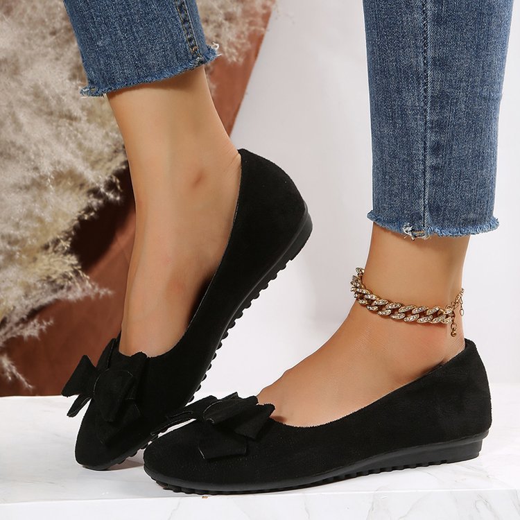 Wide fit cushioned ballet flats in black faux suede with bow detail, side view
