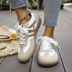 Women’s khaki and white lace-up sneakers with contrast trim and white laces