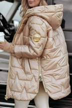 Beige hooded puffer jacket with full zipper and padded shoulder detail