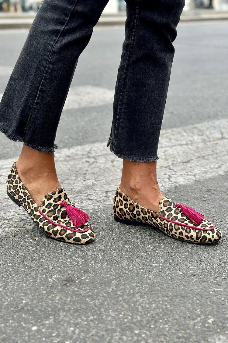 Brown animal-print loafers with fuchsia tassels, low slip-on flats