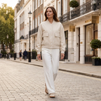 Women’s collared button-front jacket in light cream with flap pockets, relaxed fit