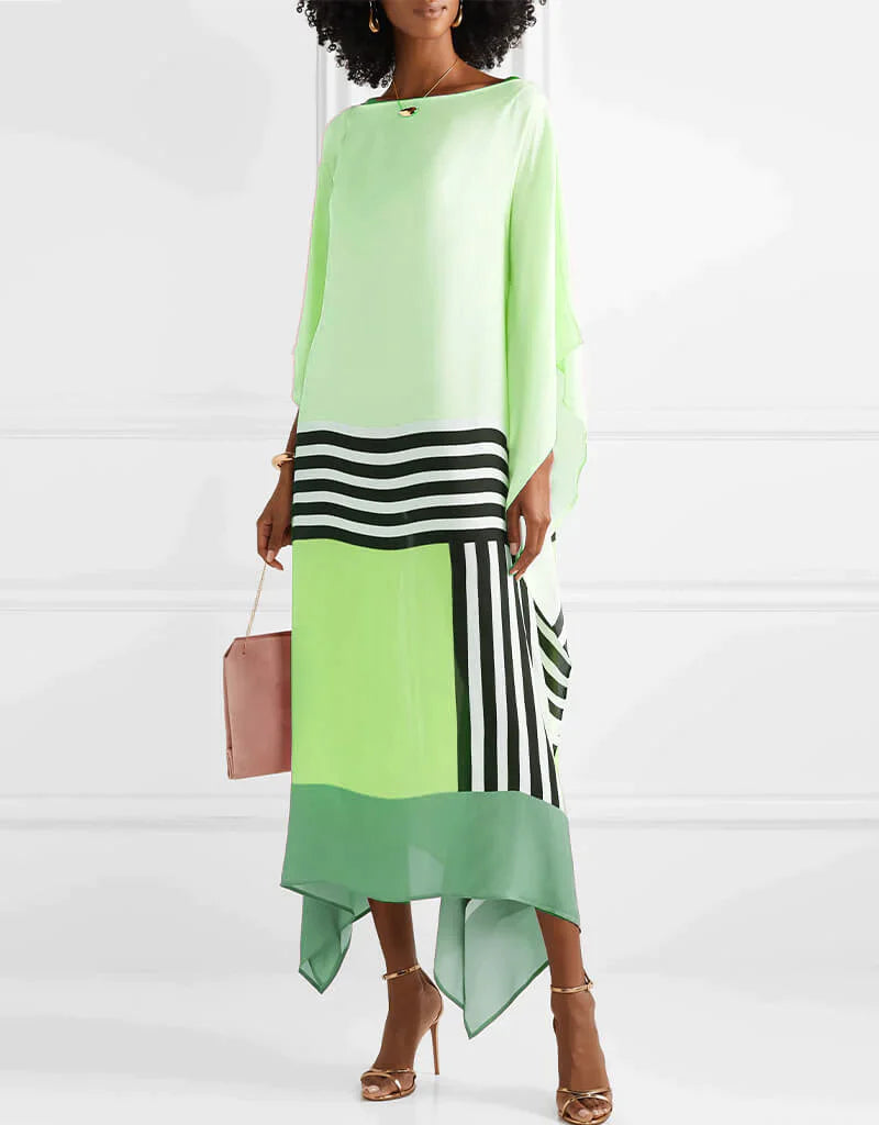 Statement caftan dress in light green with black-and-white striped panel and draped hem