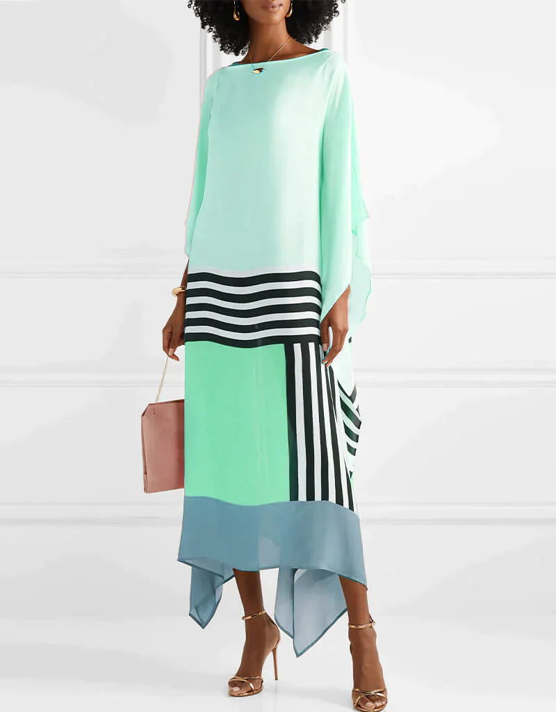 Statement caftan dress in mint blue with black-and-white stripes and asymmetrical draped hem