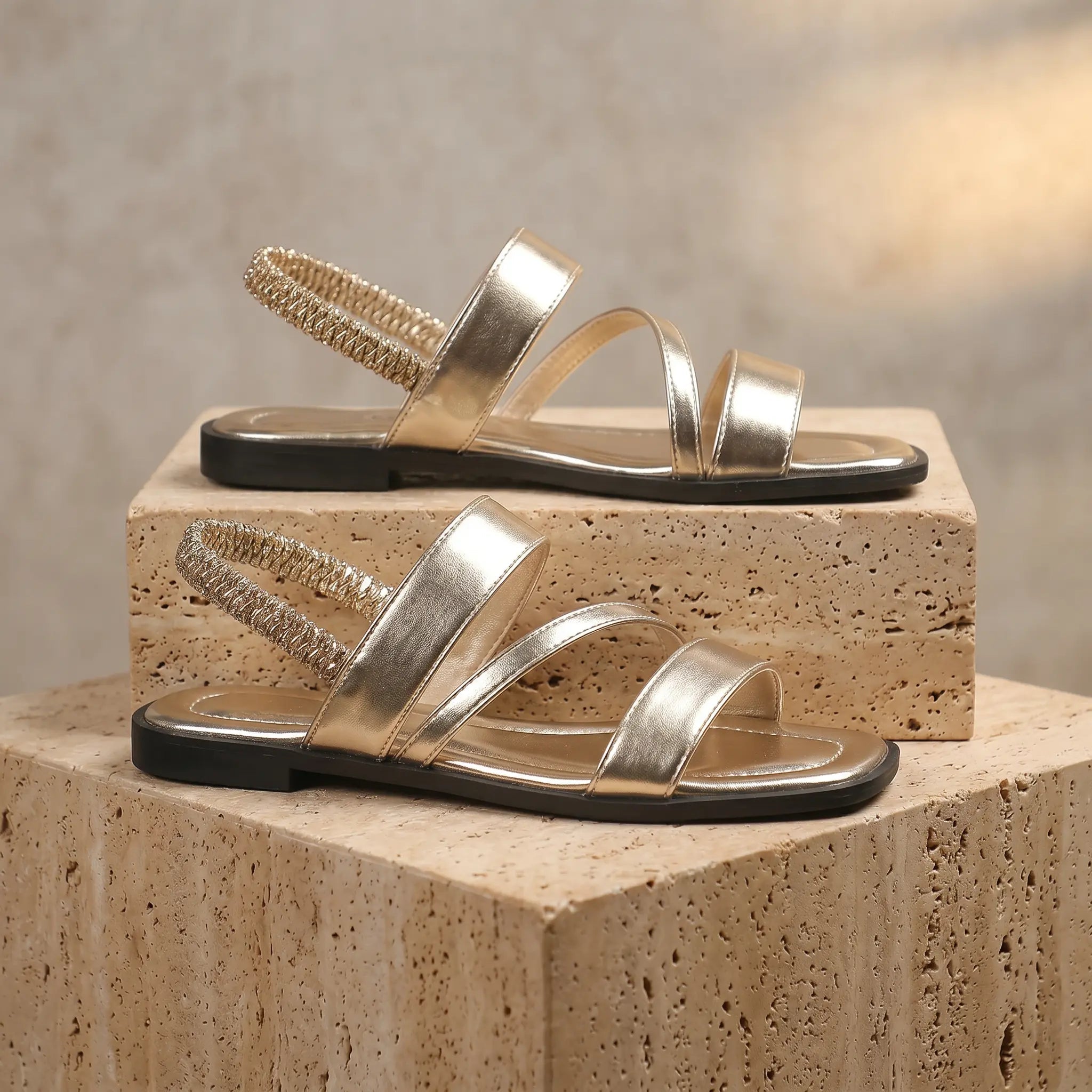 Metallic silver leather flat sandals with open square toe and elastic slingback straps