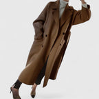 Camel long belted coat with notched lapels, cuff buttons, and side pockets
