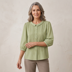 Embroidered Peter Pan collar blouse on model, light green button front with 3/4 sleeves